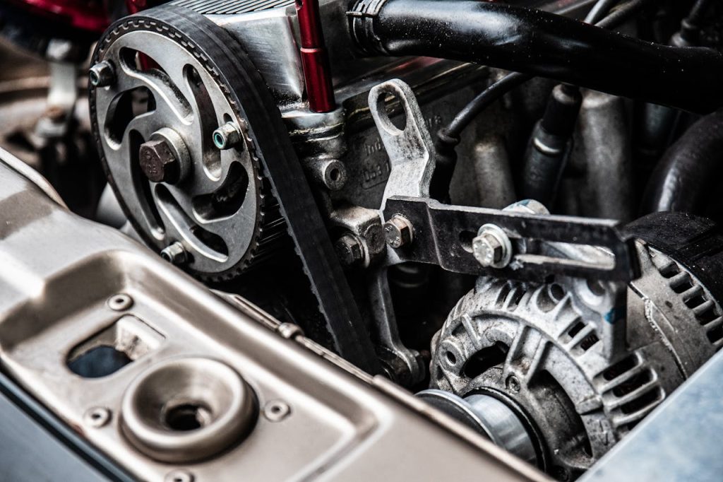 close-up-photo-of-black-and-silver-car-engine-3757226 High-resolution close-up of a car engine showing intricate mechanical parts and metallic details.
